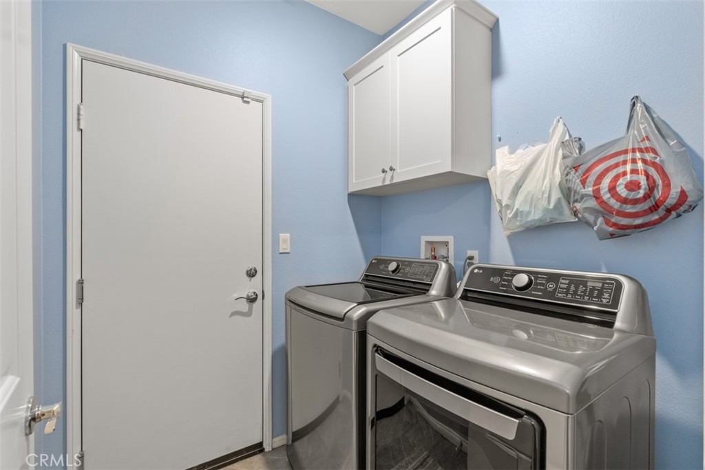 28471 Cosmos Drive Winchester, CA 92596 - Photo 11 of 27 a view of kitchen island with a stove top oven