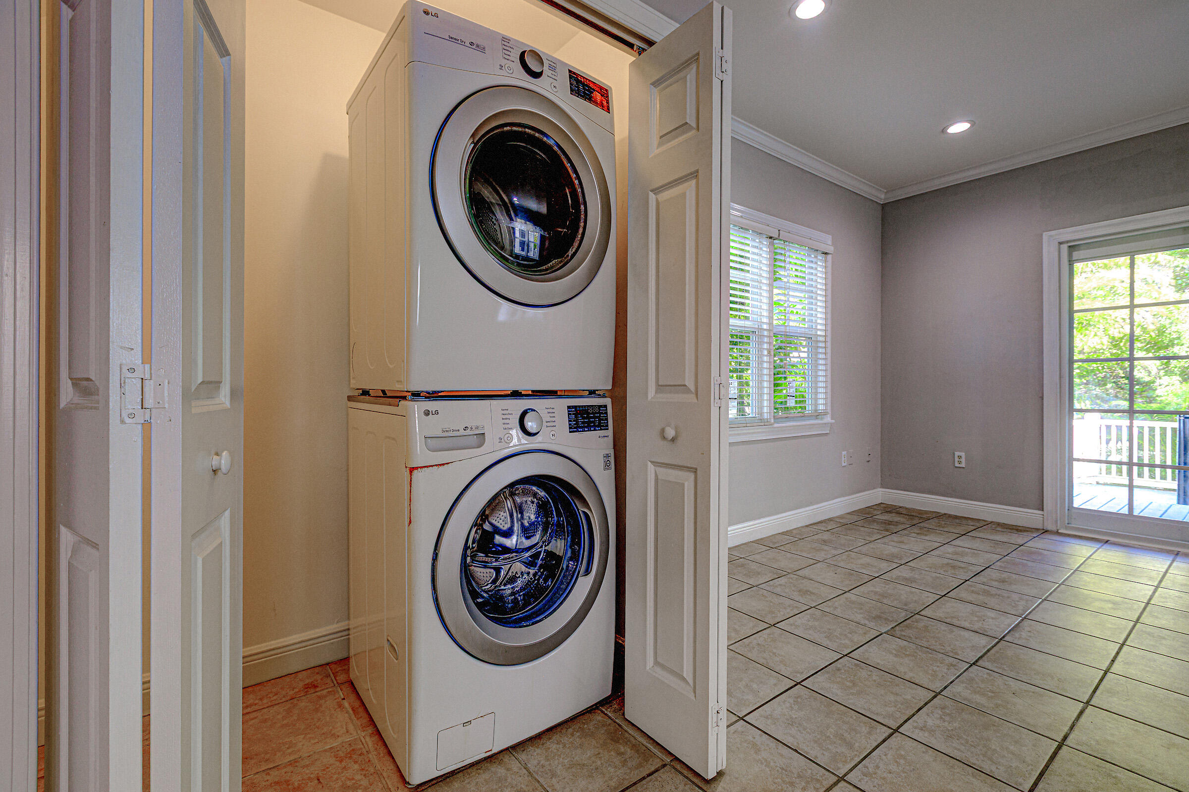 263 Golf Club Drive Key West, FL 33040 - Photo 9 of 30 a view of a hallway with washer and dryer