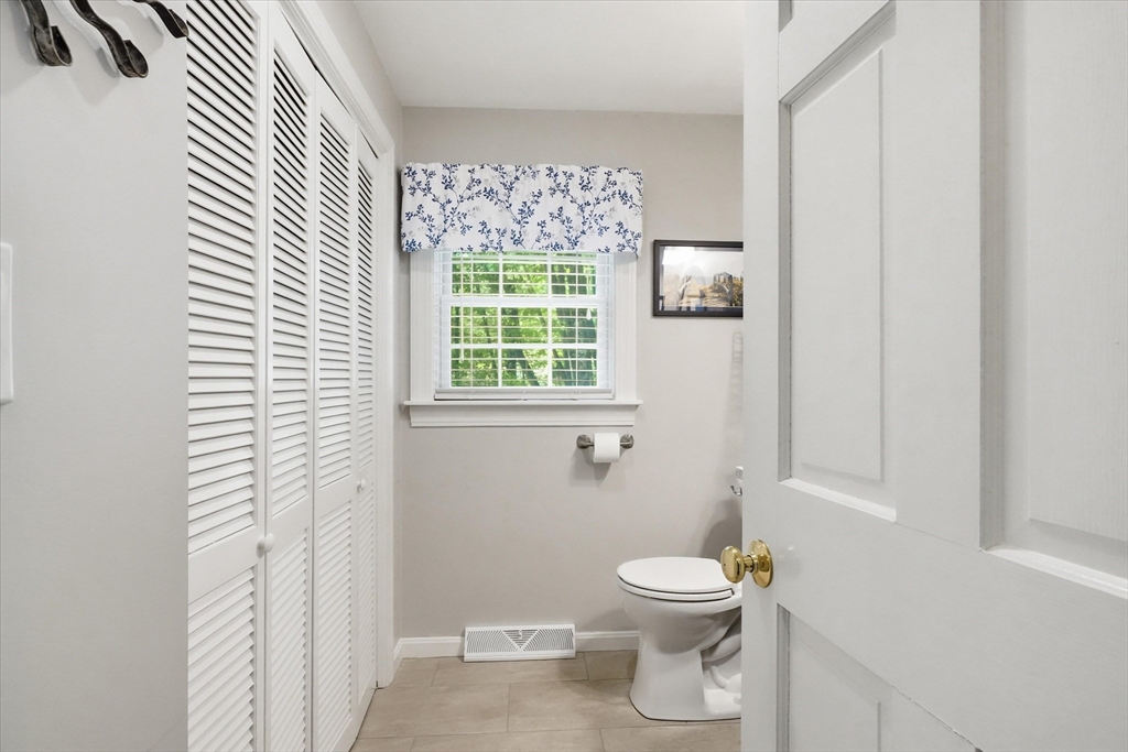9 Fazio Farm Road Georgetown, MA 01833 - Photo 17 of 42 a bathroom with a toilet a sink and a window
