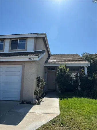 a house view with a garden space