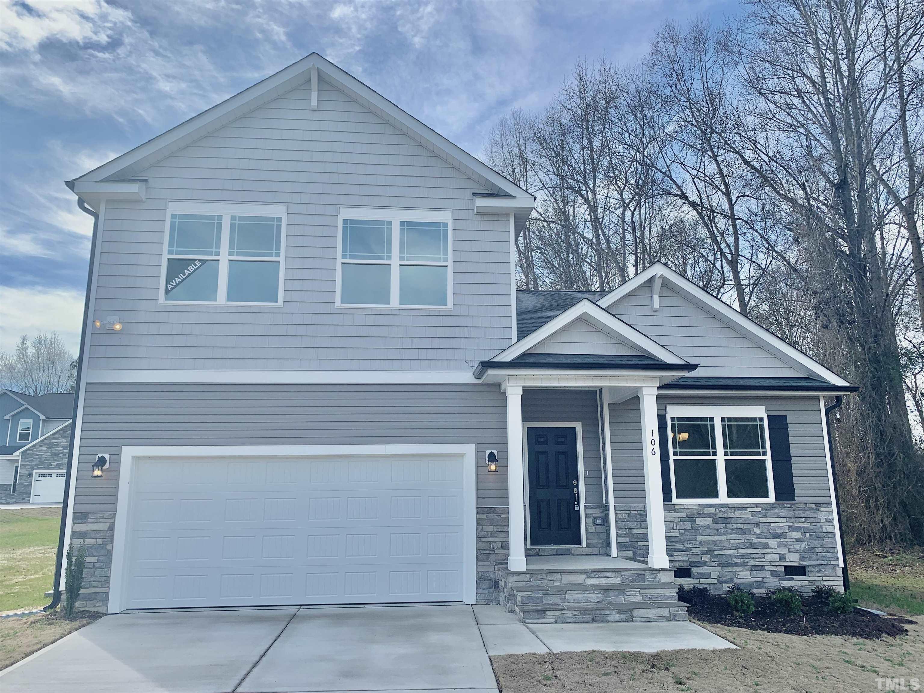 a front view of a house with a garage