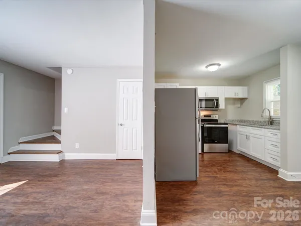 a view of kitchen with wooden floor