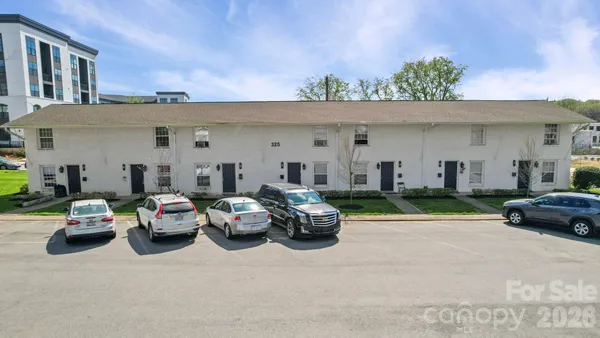 a view of a patio with a table and chairs