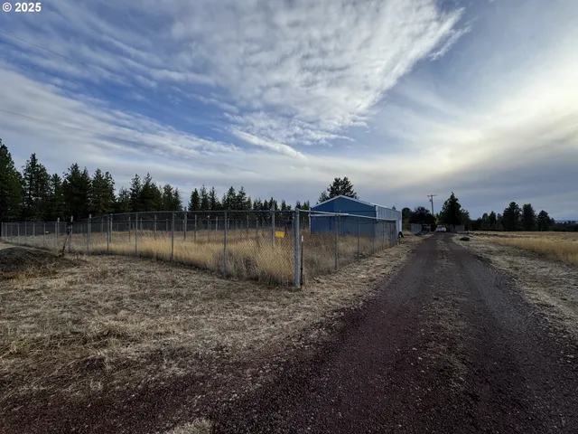 a view of a lake with houses in background