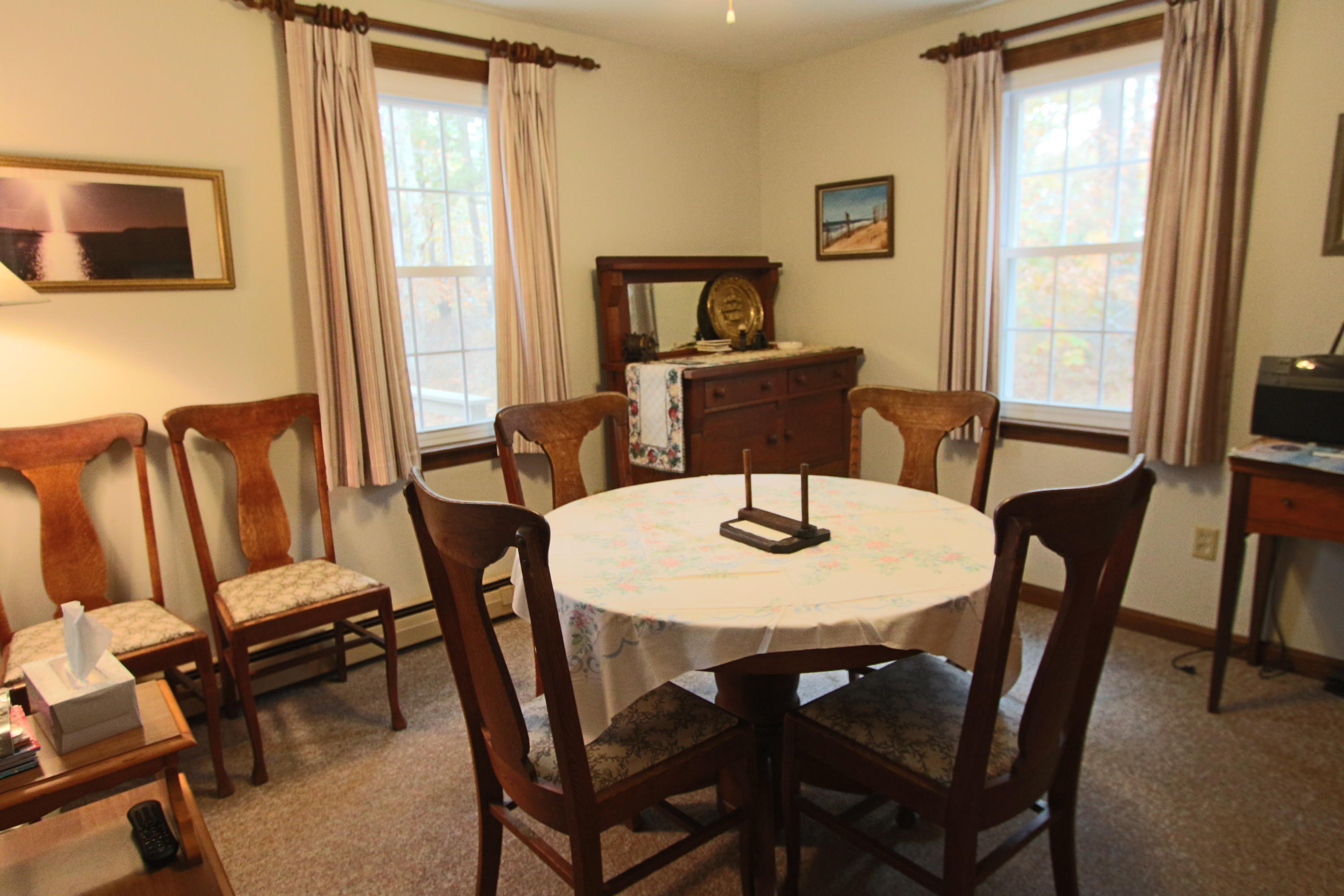 285 Long Pond Road Wellfleet, MA 02667 - Photo 11 of 28 a view of a dining room with furniture and a window