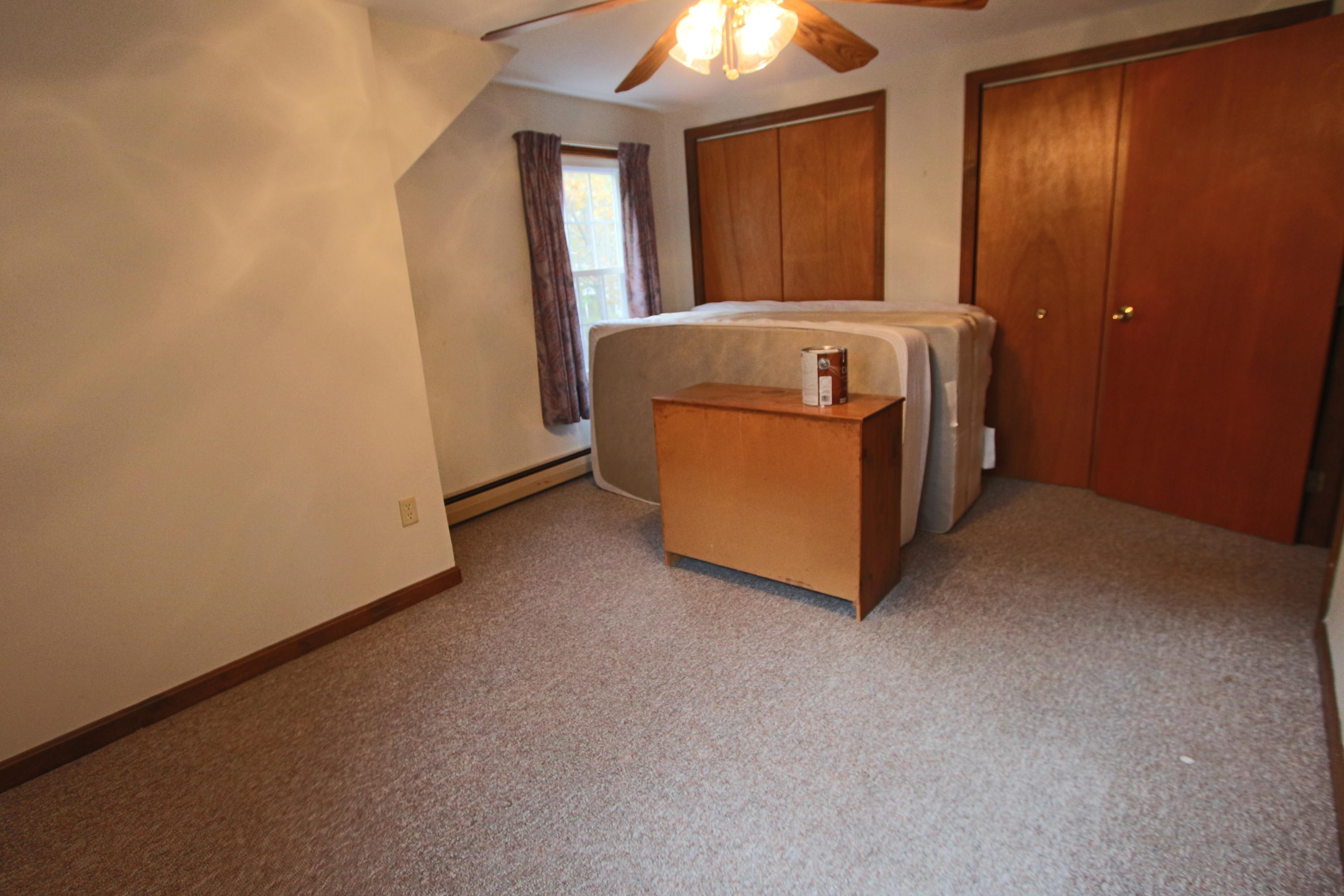 285 Long Pond Road Wellfleet, MA 02667 - Photo 16 of 28 a room with a bed and a mirror