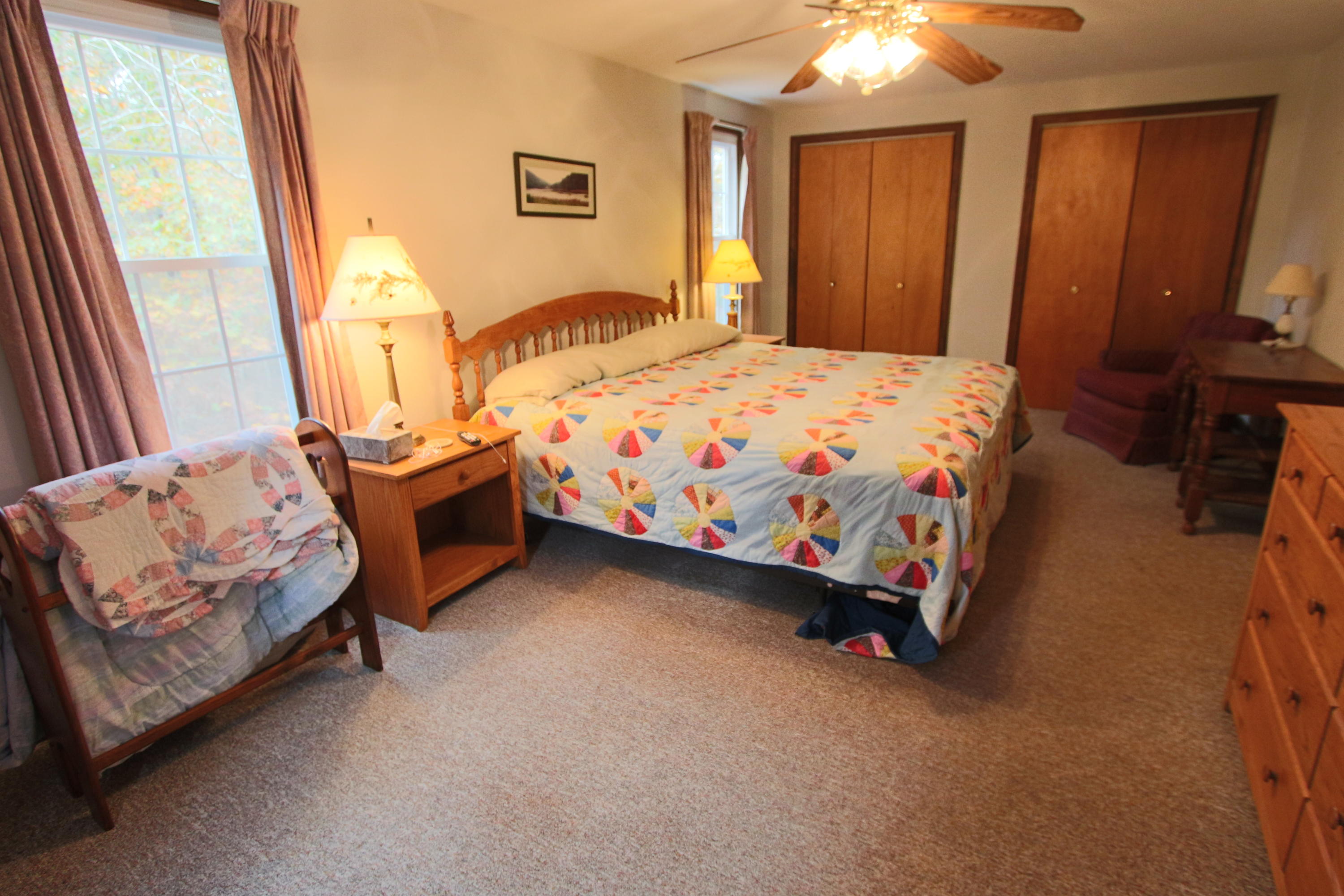 285 Long Pond Road Wellfleet, MA 02667 - Photo 3 of 28 a bedroom with a bed and a window