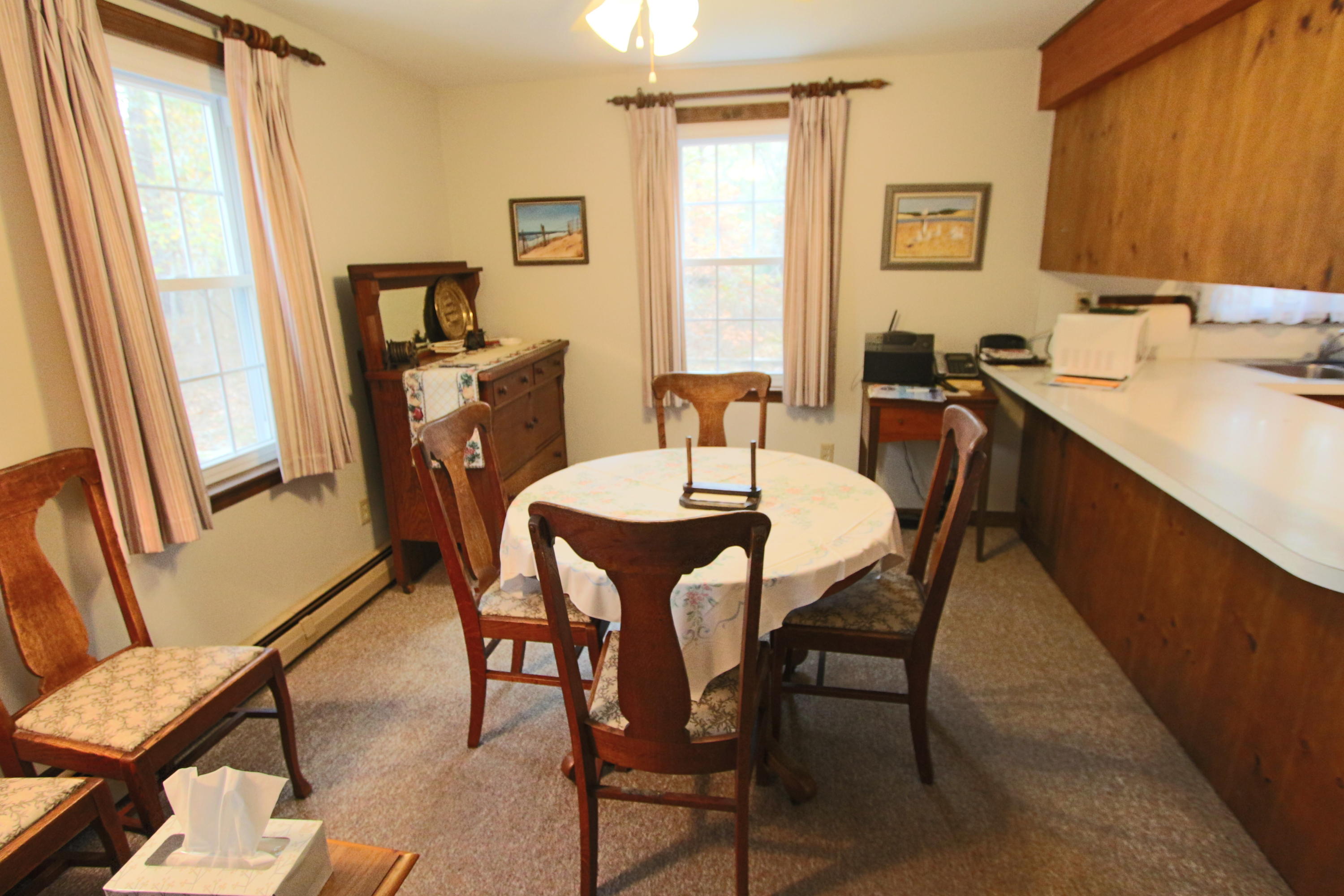 285 Long Pond Road Wellfleet, MA 02667 - Photo 10 of 28 a view of a dining room with furniture and a window
