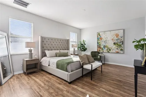 a spacious bathroom with a sink double vanity and a mirror