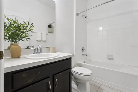 a bathroom with a bathtub and shower