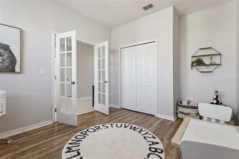 a living room with furniture a dining table and a piano table