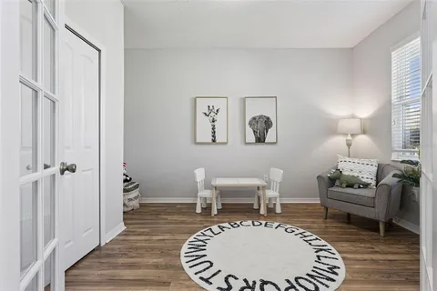 a living room with furniture and a window