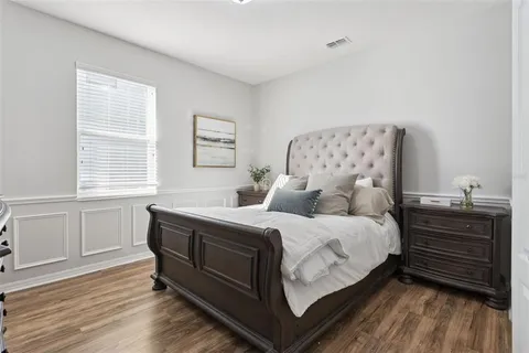 a bedroom with a bed and cabinets