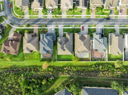a view of a lake with houses in the background