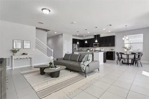 a view of a dining room with furniture and window
