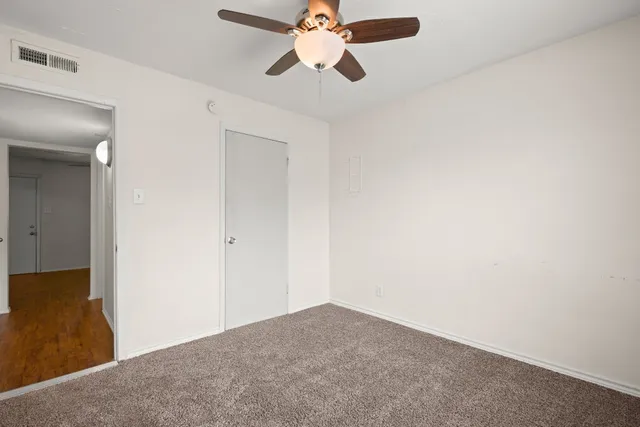a view of a chandelier fan in a room