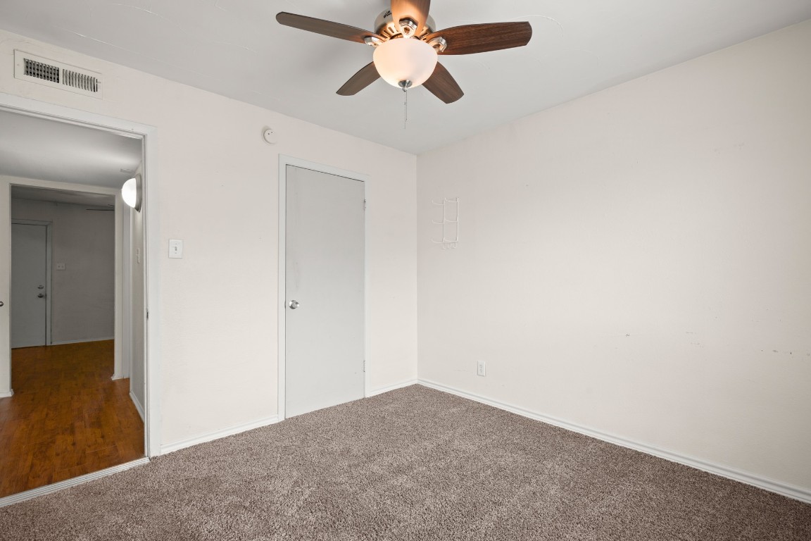2401 Manor Road, Unit 206 Austin, TX 78722 - Photo 11 of 17 a view of a chandelier fan in a room