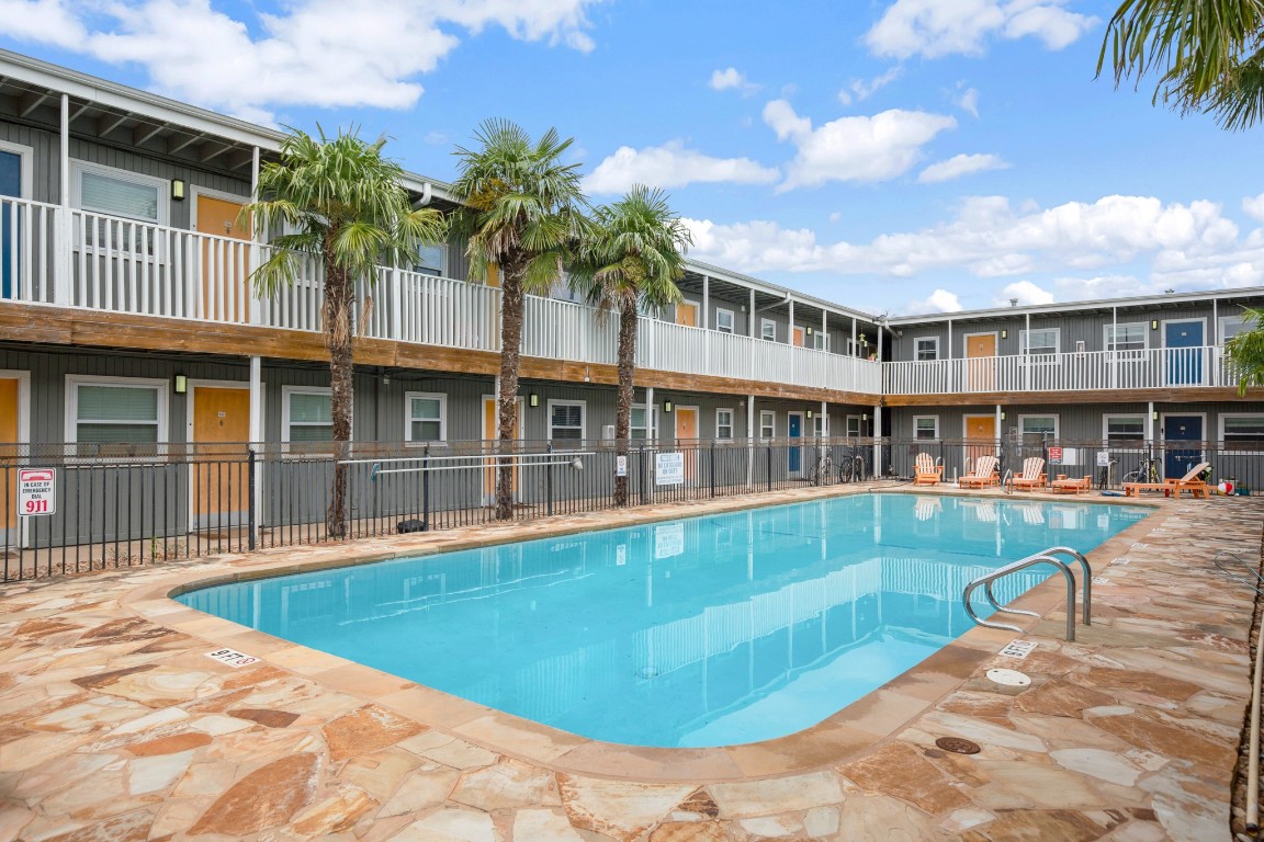 2401 Manor Road, Unit 206 Austin, TX 78722 - Photo 14 of 17 a view of a house with swimming pool and porch