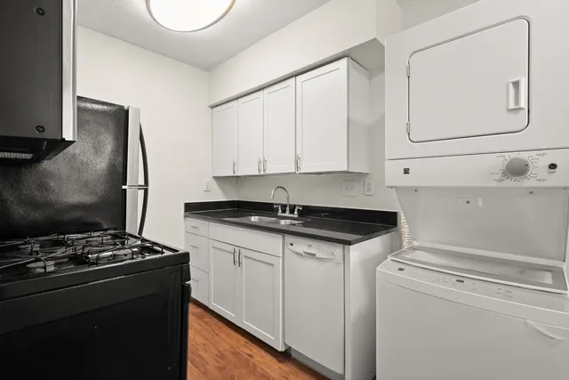 a kitchen that has a sink and a stove