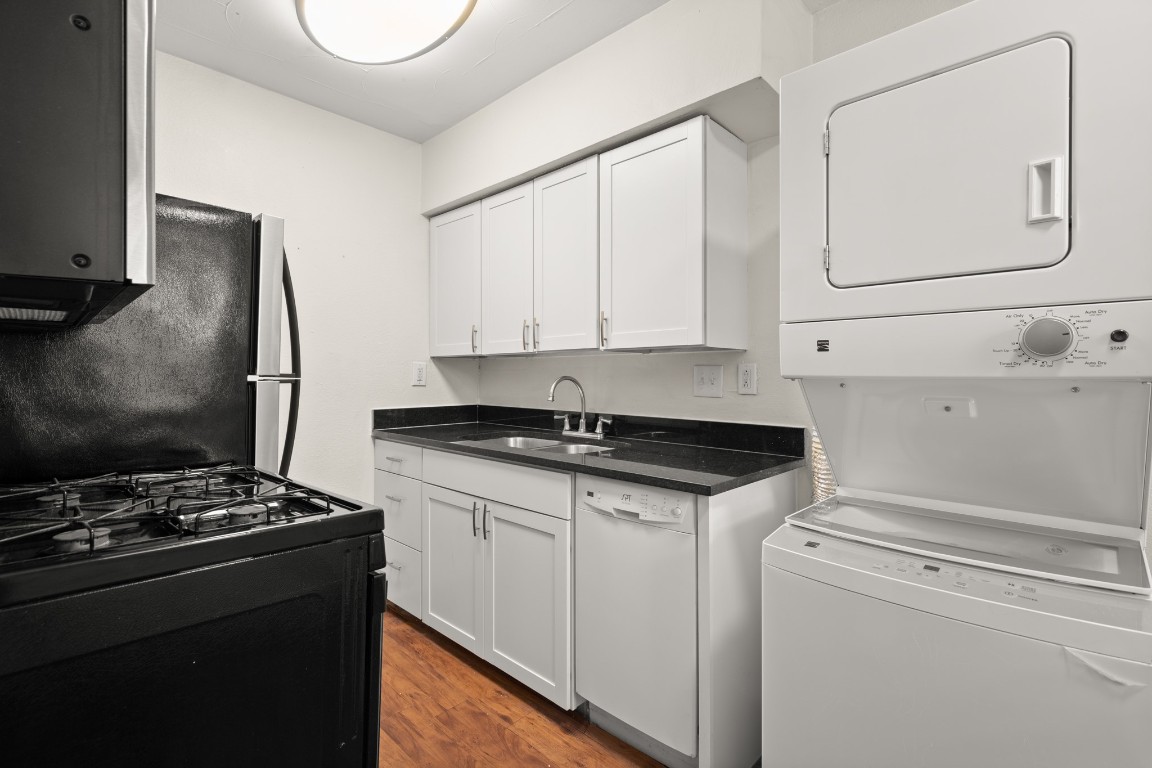 2401 Manor Road, Unit 206 Austin, TX 78722 - Photo 5 of 17 a kitchen that has a sink and a stove