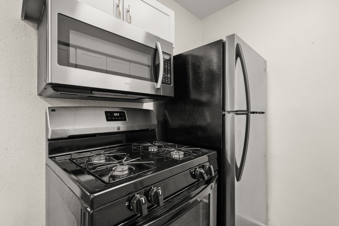2401 Manor Road, Unit 206 Austin, TX 78722 - Photo 6 of 17 a stove top oven sitting inside of a kitchen