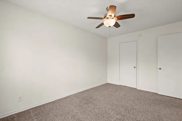 a view of room with ceiling fan