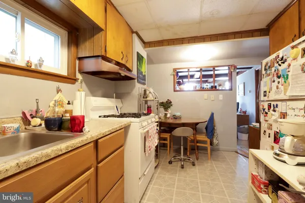 a kitchen with stainless steel appliances a sink and cabinets
