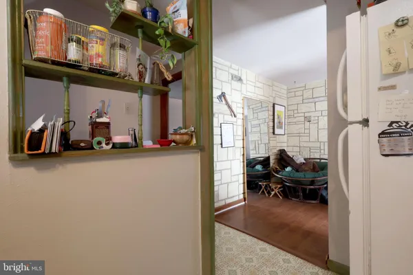 a view of a livingroom with furniture and a window
