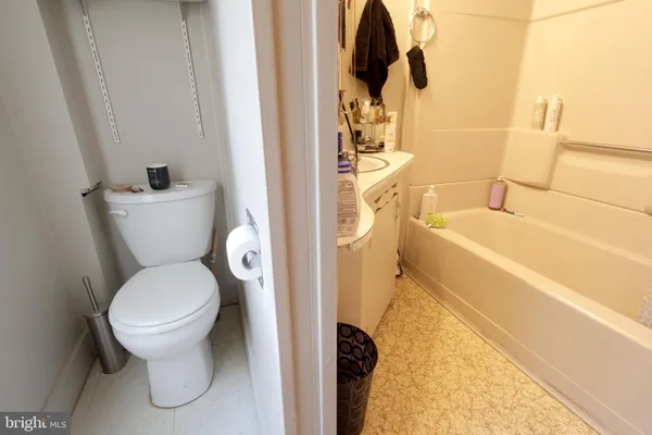 a bathroom with a toilet and a sink