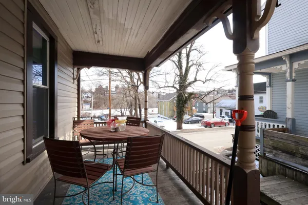 a view of a patio with a table and chairs