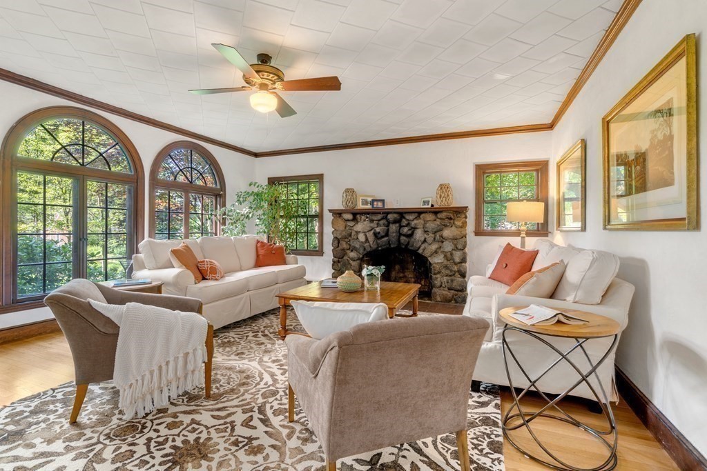 593 Peakham Road Sudbury, MA 01776 - Photo 11 of 42 a living room with fireplace furniture and a large window