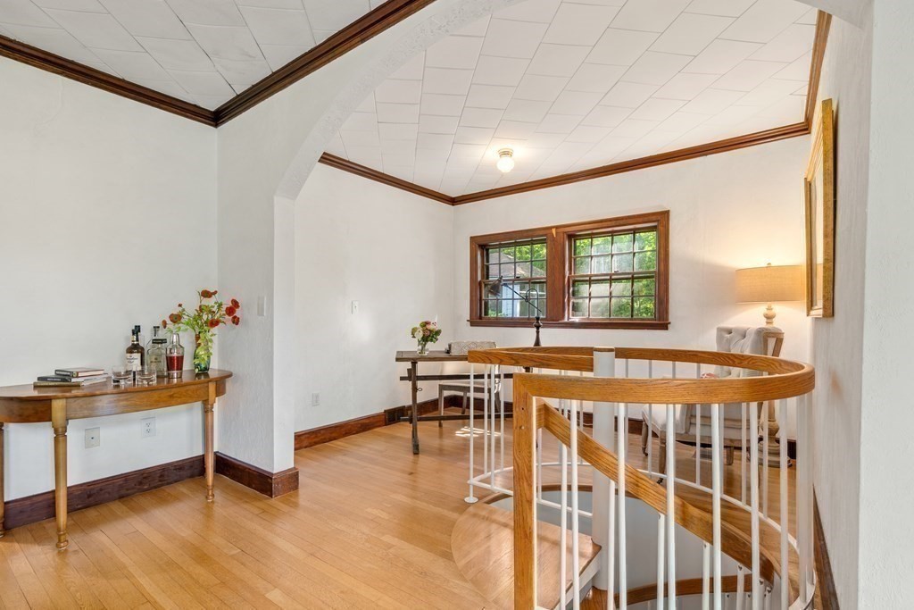 593 Peakham Road Sudbury, MA 01776 - Photo 12 of 42 a dining room with wooden floor and a table and chairs