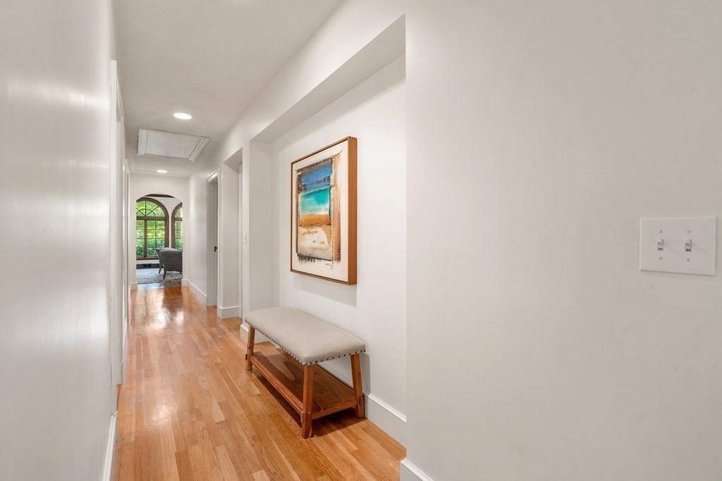 593 Peakham Road Sudbury, MA 01776 - Photo 13 of 42 a view of hallway with livingroom and wooden floor