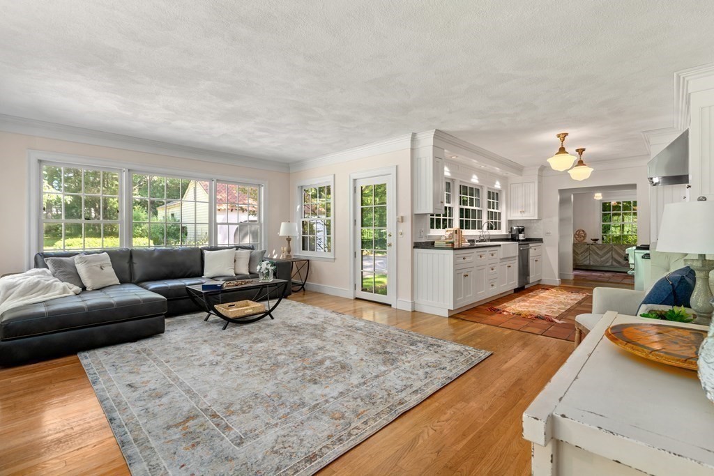 593 Peakham Road Sudbury, MA 01776 - Photo 17 of 42 a living room with furniture and a table