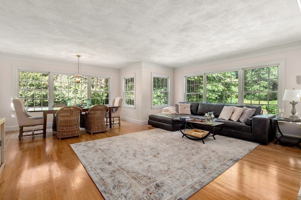 593 Peakham Road Sudbury, MA 01776 - Photo 18 of 42 a living room with furniture and a large window
