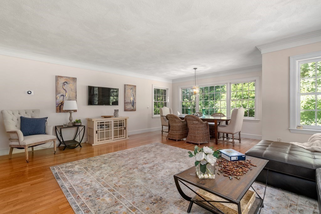 593 Peakham Road Sudbury, MA 01776 - Photo 19 of 42 a living room with furniture and a flat screen tv