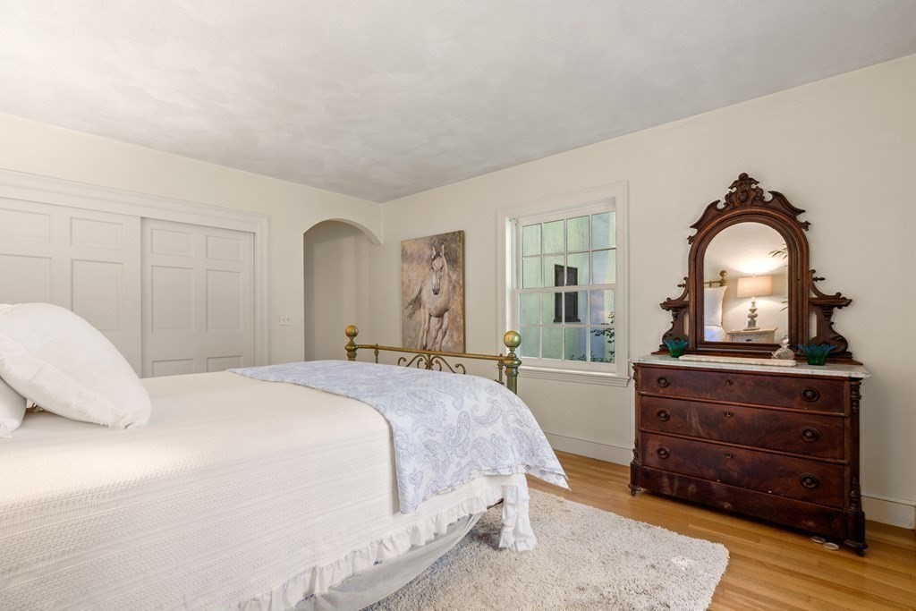 593 Peakham Road Sudbury, MA 01776 - Photo 21 of 42 a bedroom with a bed and a dresser