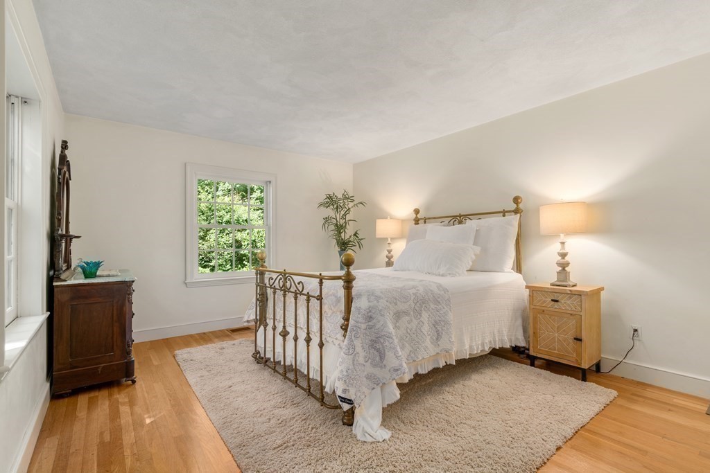 593 Peakham Road Sudbury, MA 01776 - Photo 22 of 42 a bed room with a bed and a window