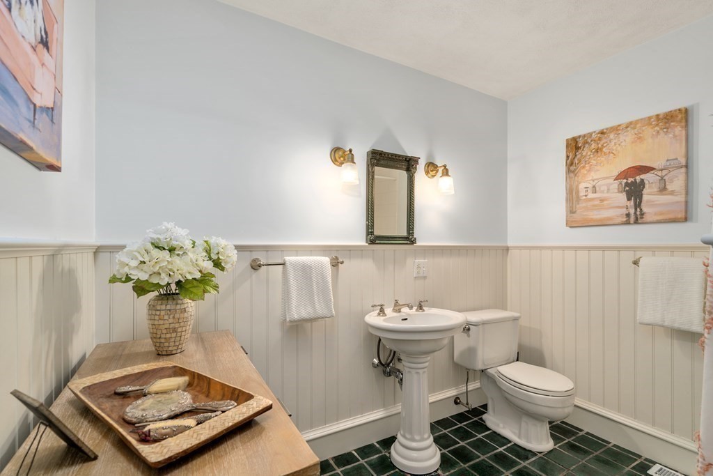 593 Peakham Road Sudbury, MA 01776 - Photo 23 of 42 a bathroom with a toilet sink and mirror