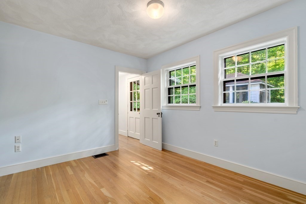 593 Peakham Road Sudbury, MA 01776 - Photo 24 of 42 an empty room with windows