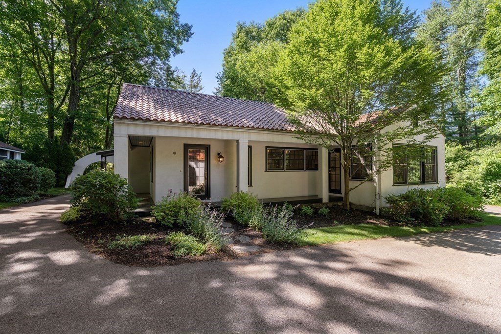 593 Peakham Road Sudbury, MA 01776 - Photo 30 of 42 a front view of a house with garden