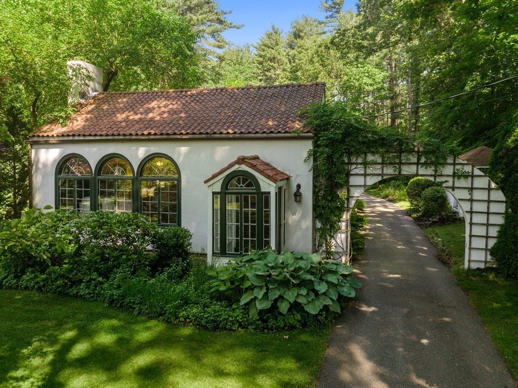593 Peakham Road Sudbury, MA 01776 - Photo 3 of 42 a front view of a house with garden