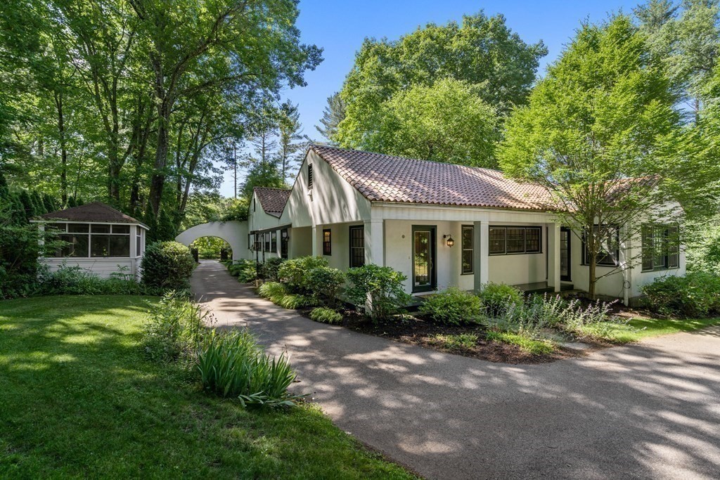 593 Peakham Road Sudbury, MA 01776 - Photo 33 of 42 a view of a house with a yard and potted plants