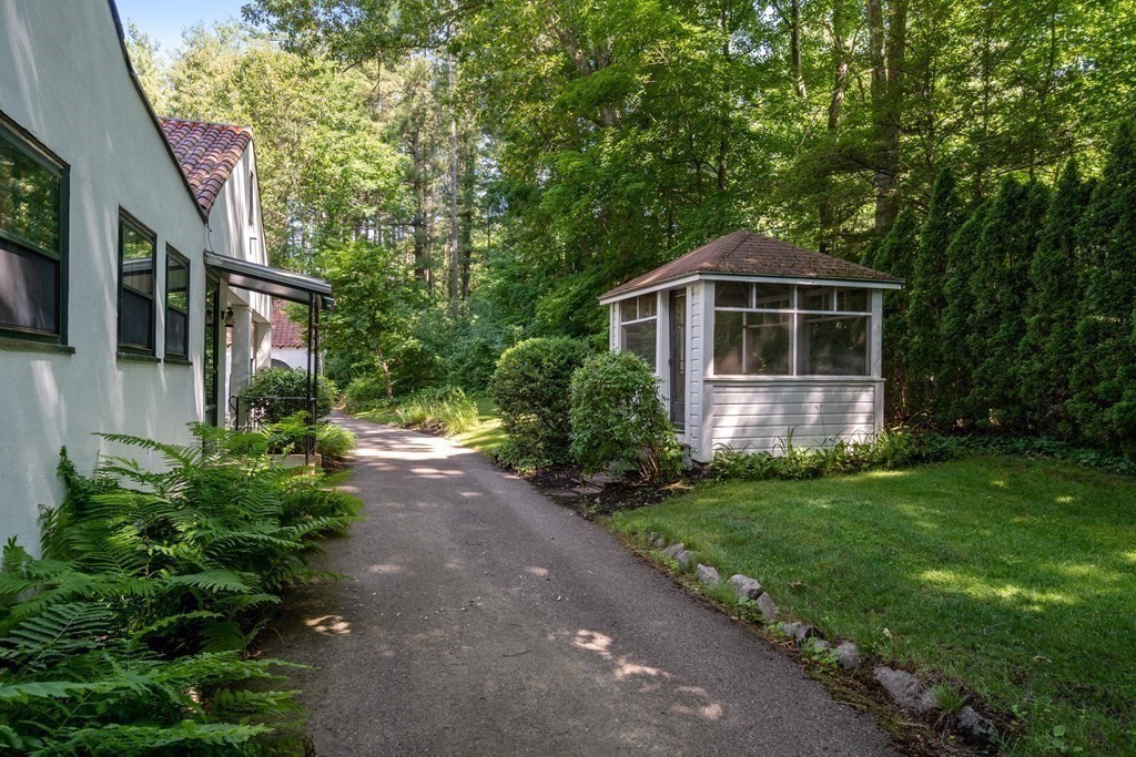 593 Peakham Road Sudbury, MA 01776 - Photo 35 of 42 a front view of a house with garden