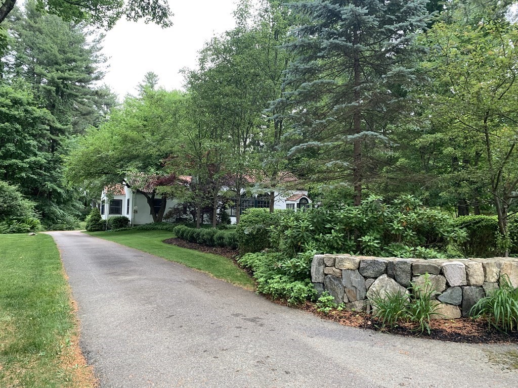 593 Peakham Road Sudbury, MA 01776 - Photo 36 of 42 a front view of a house with a yard