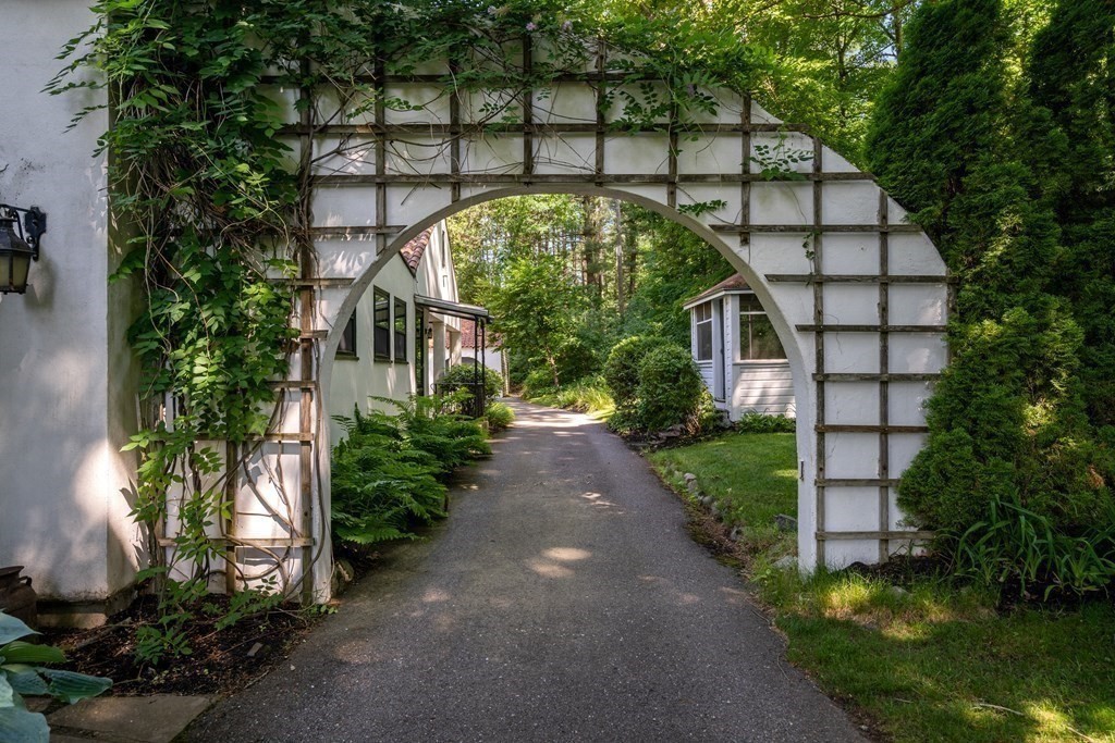 593 Peakham Road Sudbury, MA 01776 - Photo 4 of 42 a view of a pathway both side of house