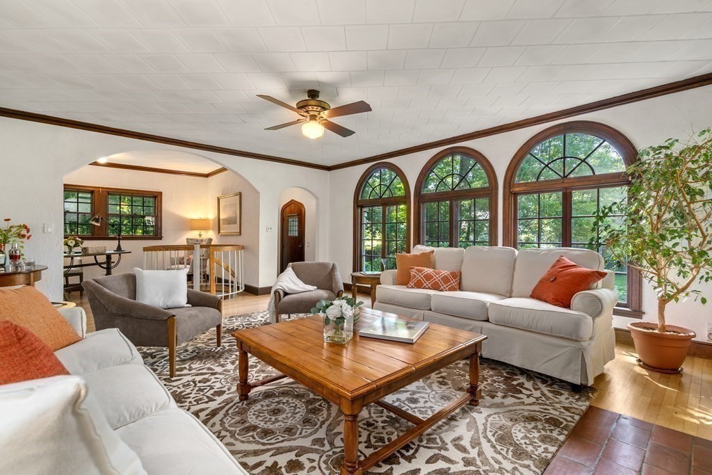593 Peakham Road Sudbury, MA 01776 - Photo 9 of 42 a living room with furniture a large window and a chandelier