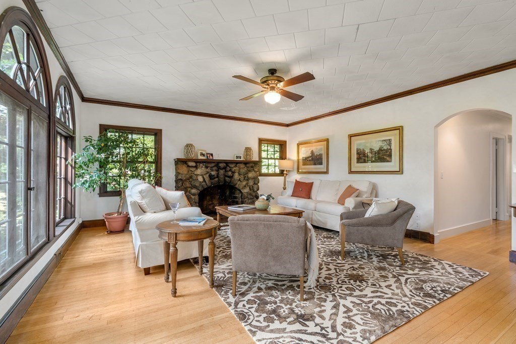 593 Peakham Road Sudbury, MA 01776 - Photo 10 of 42 a living room with furniture and a fireplace