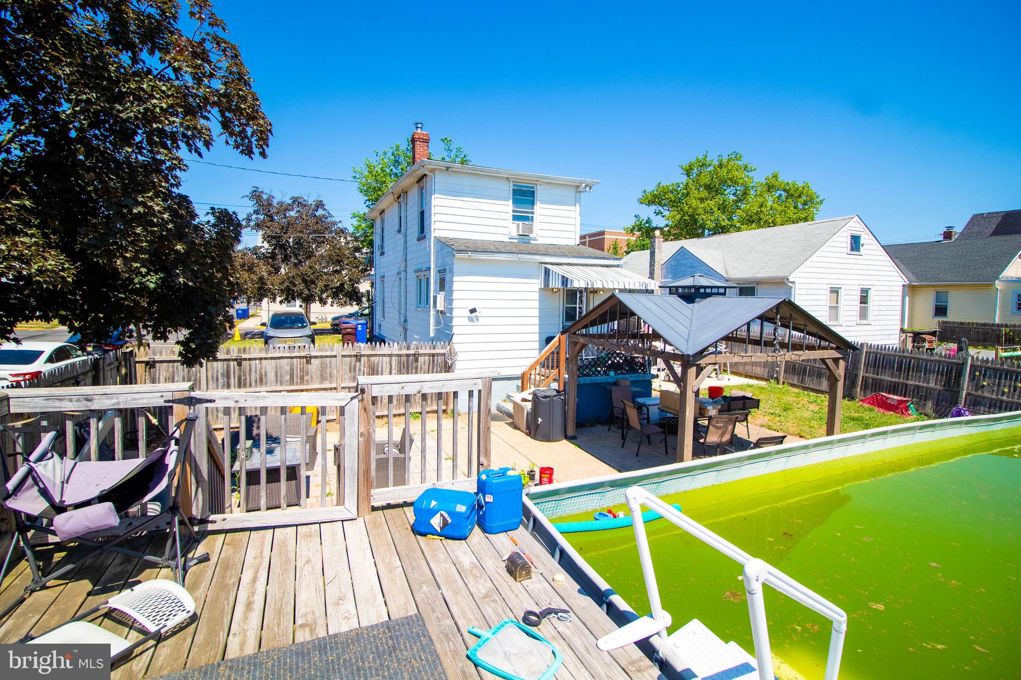 100 Grant Street Riverside, NJ 08075 - Photo 6 of 34 a view of a house with pool and chairs