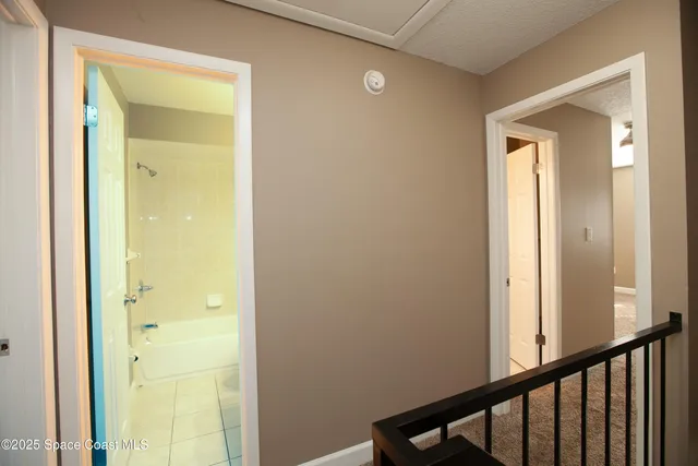 a view of a bathroom from a hallway